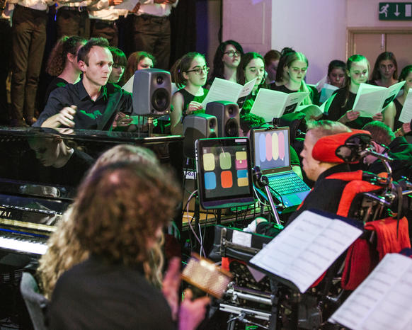 Young disabled bodied musicians play thier instruments as part of the National Open Youth Orchestra