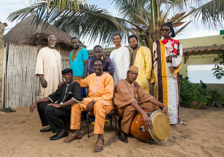 Orchestra Baobab posing with their instruments