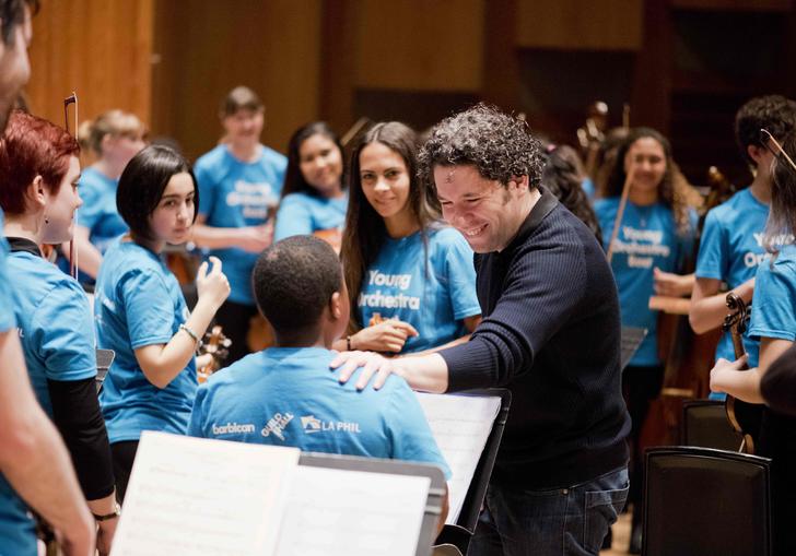Gustavo Dudamel with young musicians from the Young Orchestra East