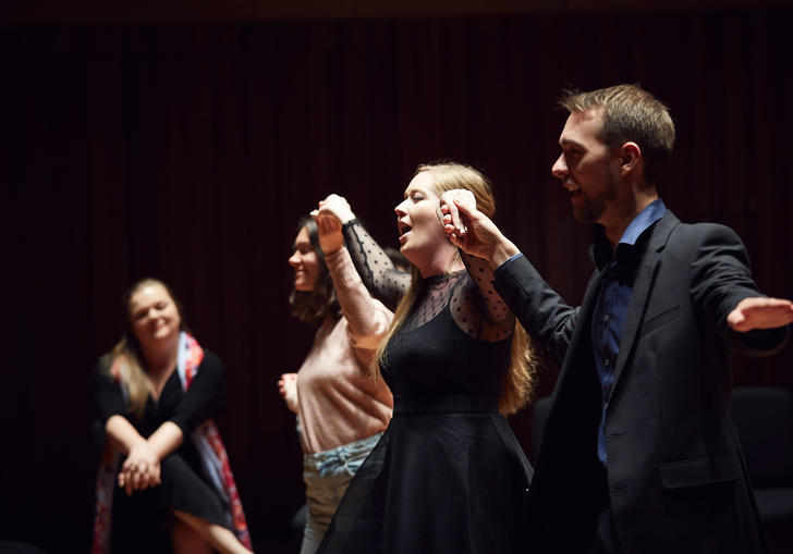 Guildhall singers perform on stage