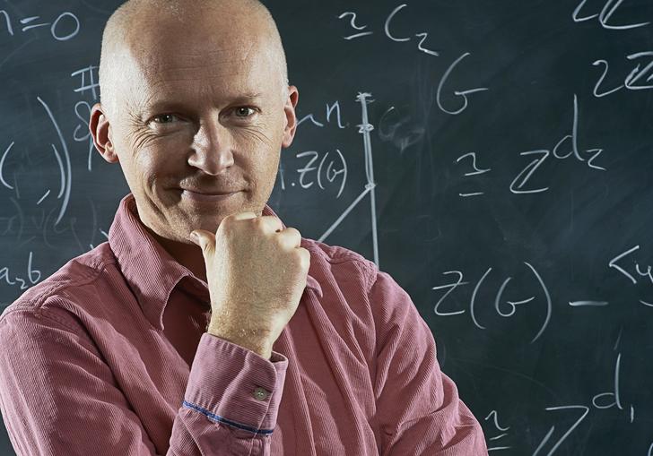 Marcus du Sautoy in front of a blackboard