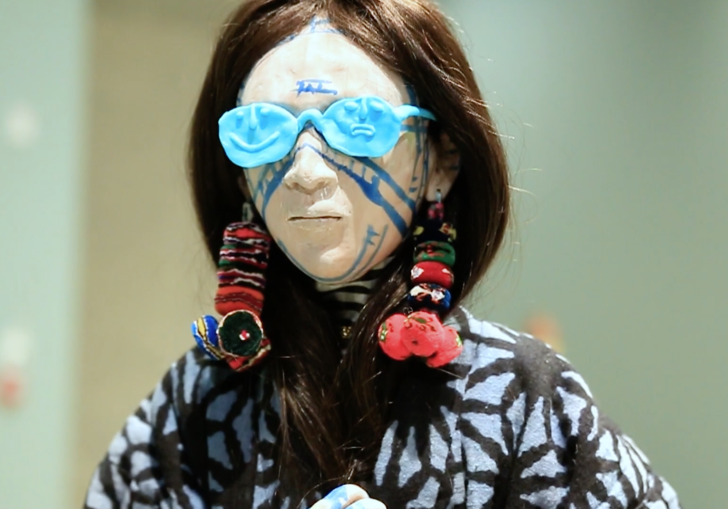 photo of sculpture of woman with blue sunglasses