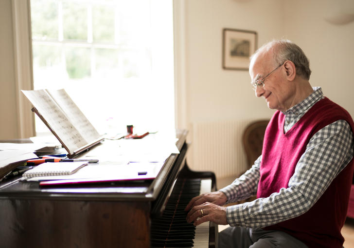 John Rutter sat at piano