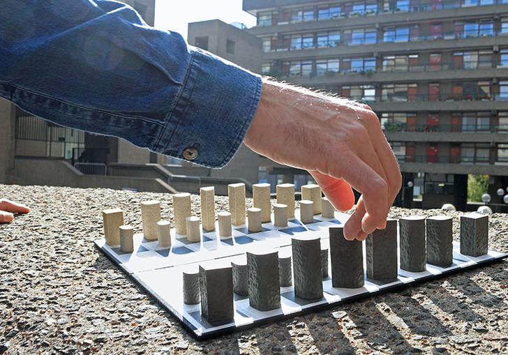 Hand and chess board 