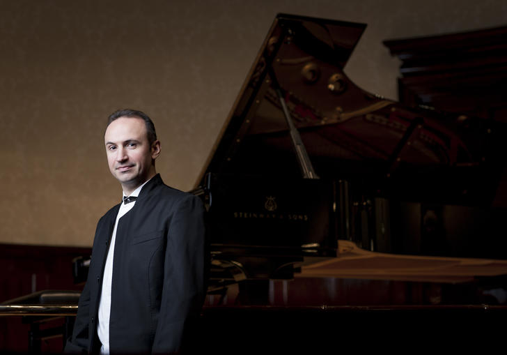 Simon Trpceski standing near piano