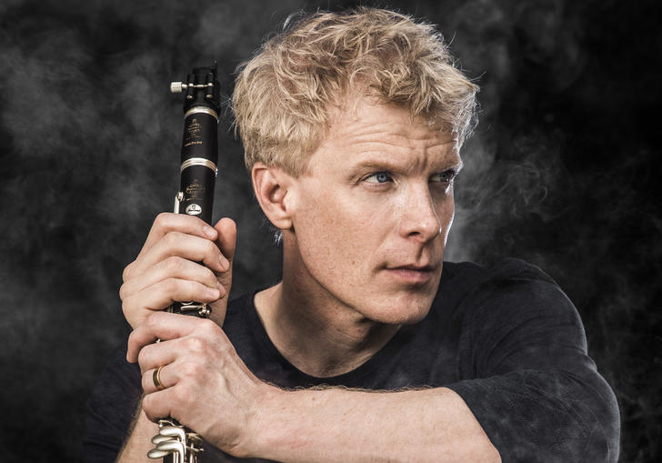 martin Frost holding clarinet smoke