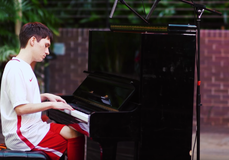 Man playing piano in Conservatory 