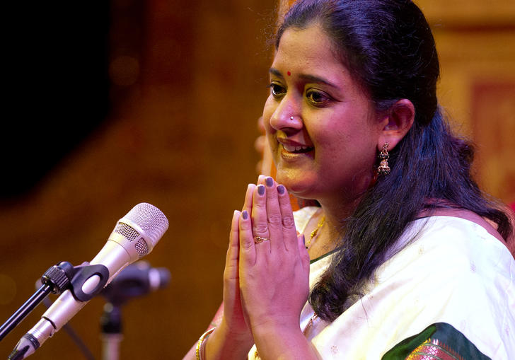 Mankiri Asnare presses her hands together as she sings