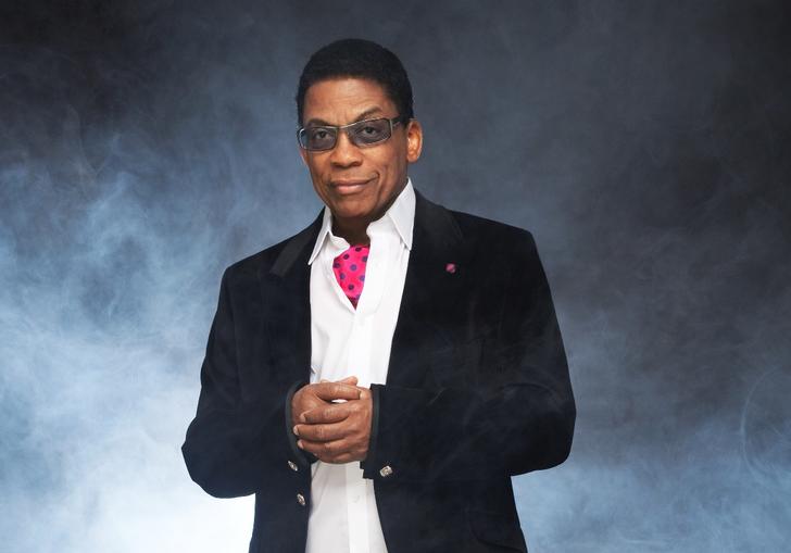 Herbie Hancock wearing a suit and pink cravat