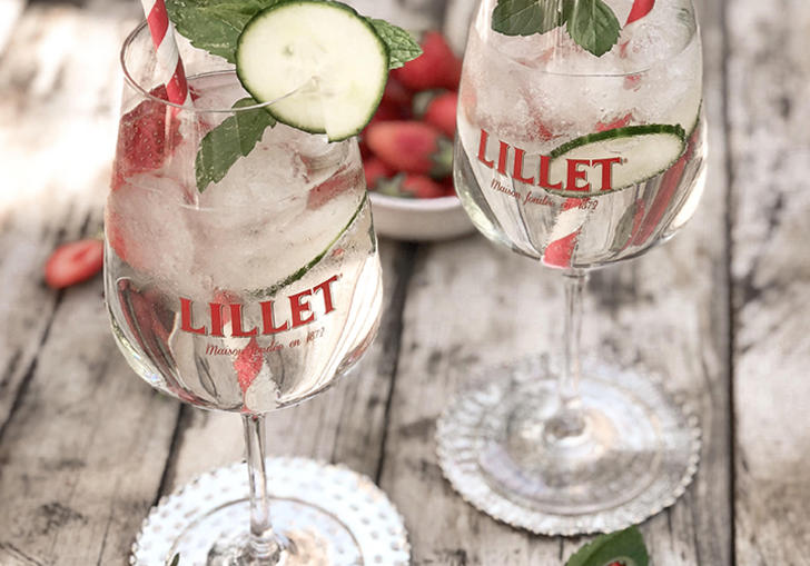Photo of two Lillet cocktails set on wooden table
