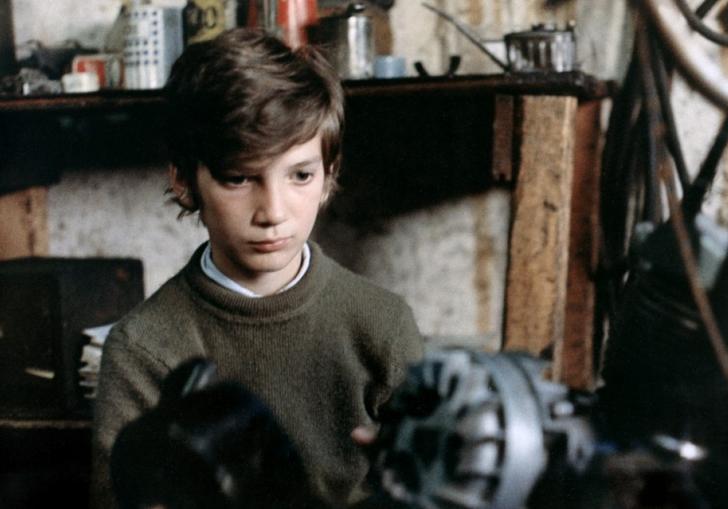 Photo of young man holding weights