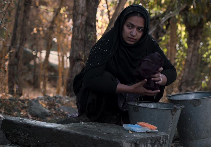 A woman washing her laundry