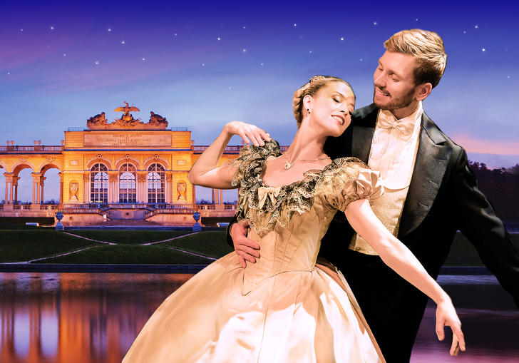 A couple waltzing outside the Schonbrunn Palace