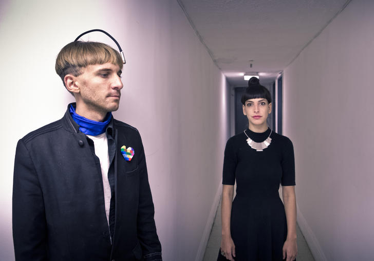 An image of Neil Harbisson and Moon Ribas gazing into the distance 