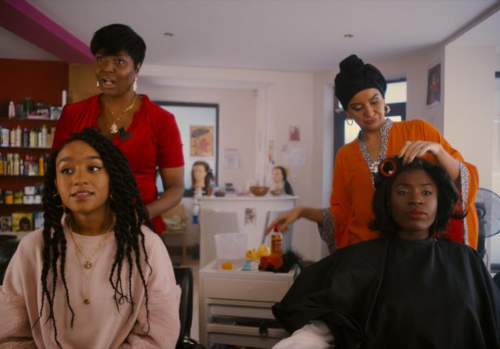 four women in a hairdressers shop