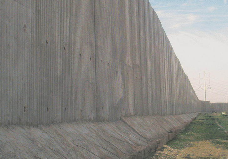 The berlin wall against a blue sky