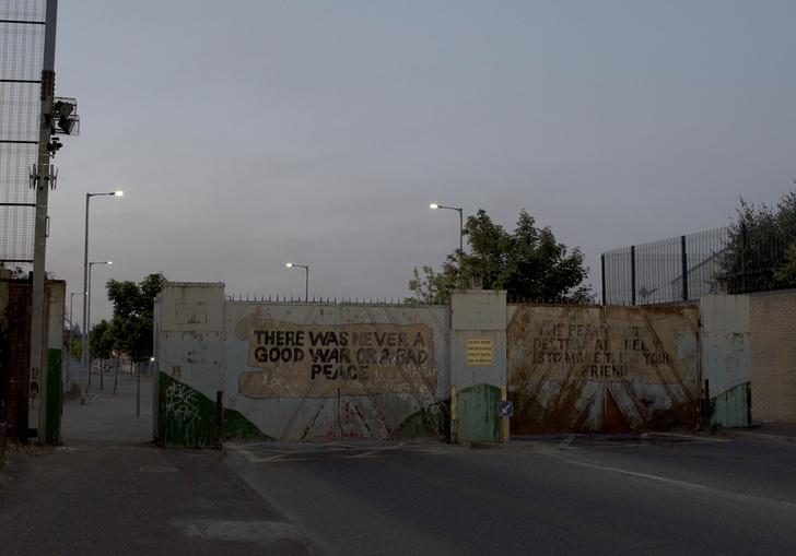 Berlin wall set against a grey sky backdrop