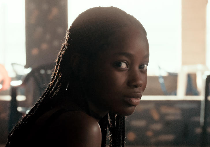 A young woman, Ada, looks directly into the camera in Mati Diop's Atlantics