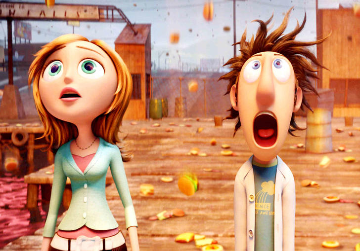 Flint standing looking up at the sky as food falls down