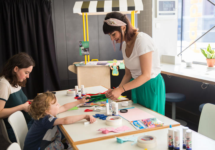 A young child does a workshop at the Family Film Kiosk