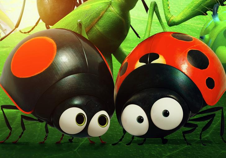 two lady birds sitting on a green leaf