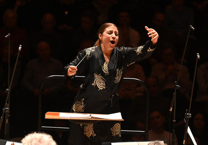 Dalia conducting with great enthusiasm