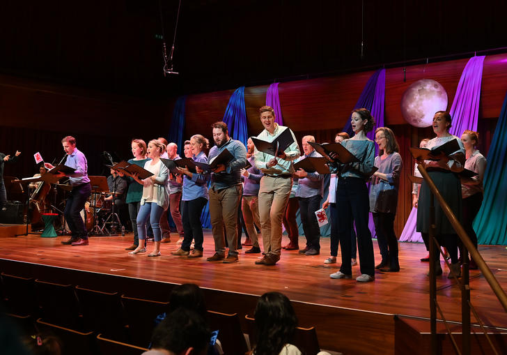 The BBC singers singing joyfully 