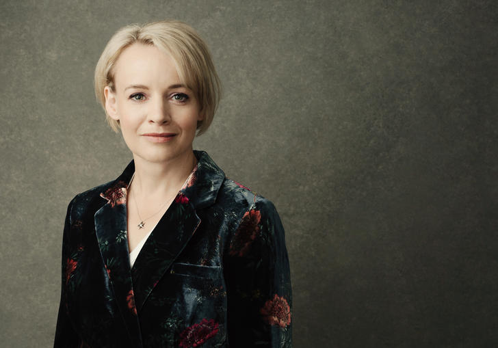 A portrait of Rachel Nicholls wearing a floral velvet blazer
