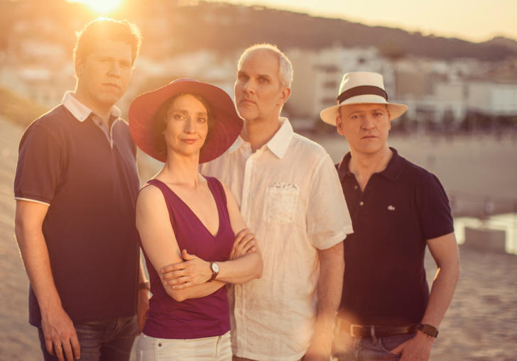 The Casals Quartet posing together as the golden Spanish sun sets in the background 