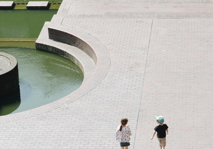 two people walking on the lakeside