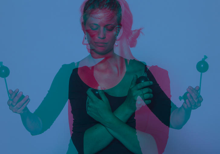 An overlaid image of Vanessa Porter with her drumming sticks