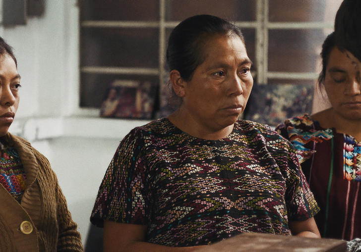 A man speaking to three women