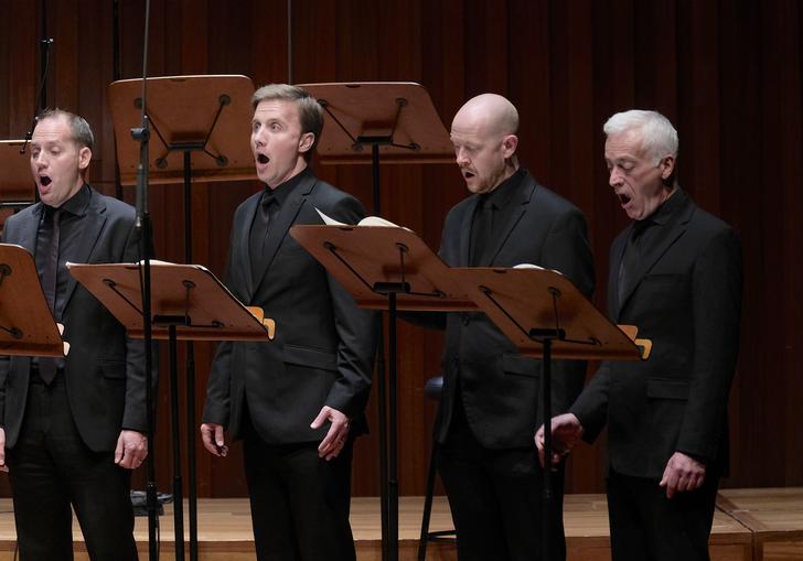 Four of the men of BBC Singers singing