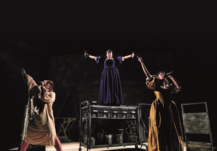 three women singing triumphantly