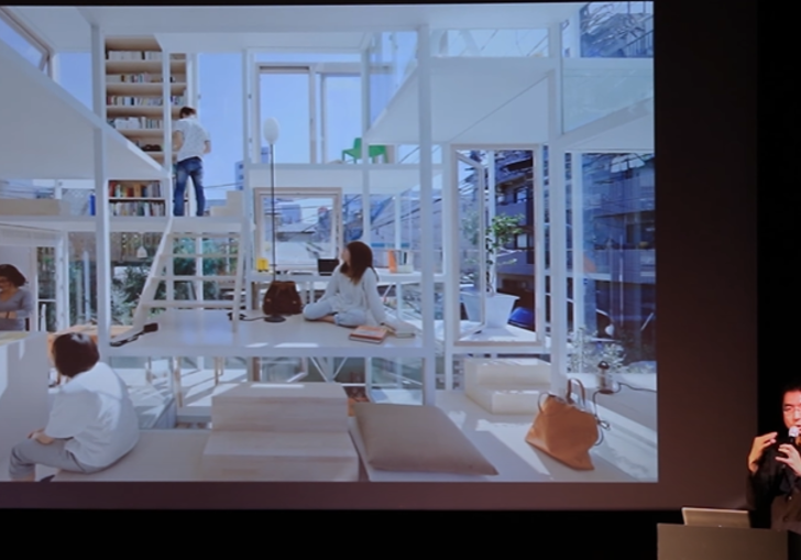 Sou Fujimoto in front of a slide during a lecture