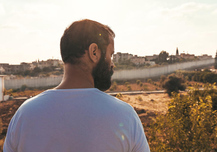 A man looks out at the wall in 200 meters