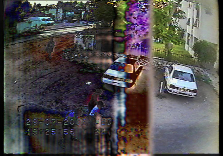A CCTV image of a car park in An Unusual Summer