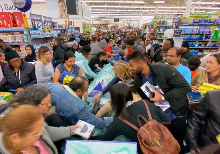 people fight to get the products they want in a supermarket