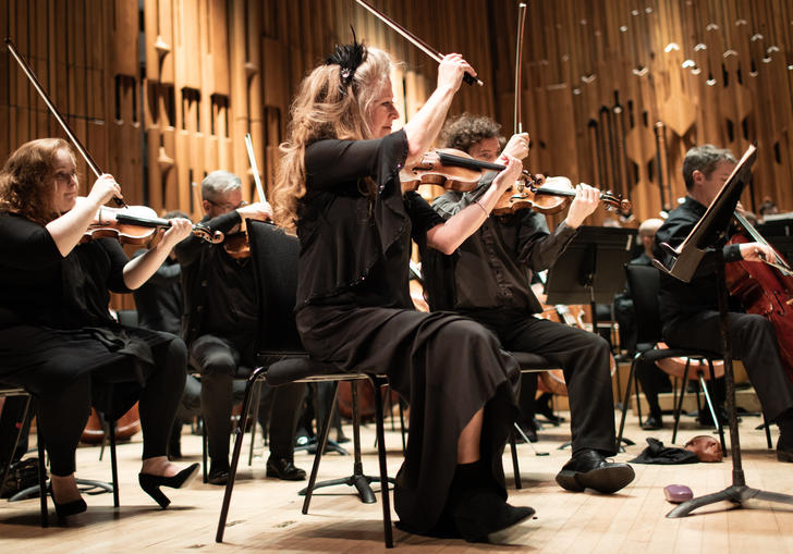 Some of the member of Britten Sinfonia on the Barbican stage