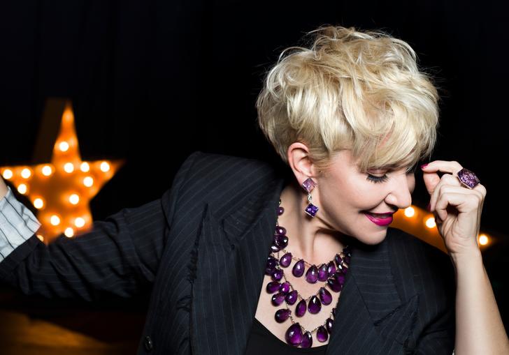 Joyce DiDonato smiling looking down at the floor