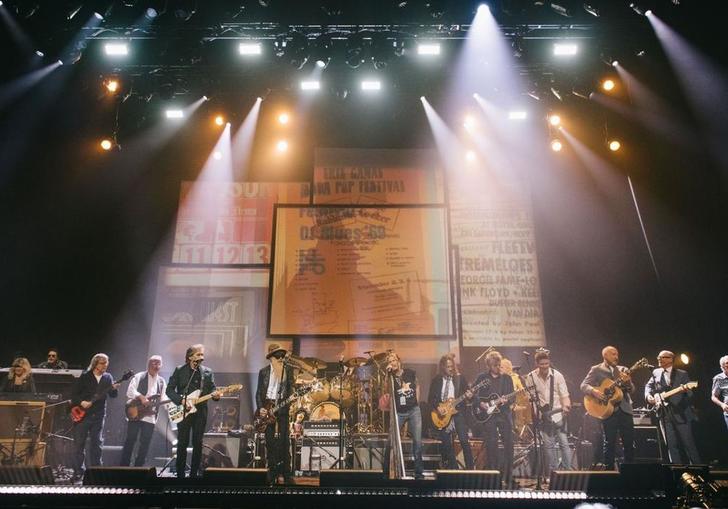 a collection of famous rock stars on stage