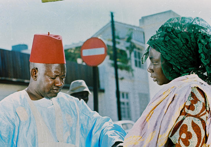 a man reaches out to a woman and closes his eyes