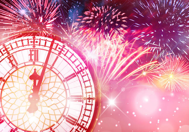 Big Ben's clock with fireworks behind