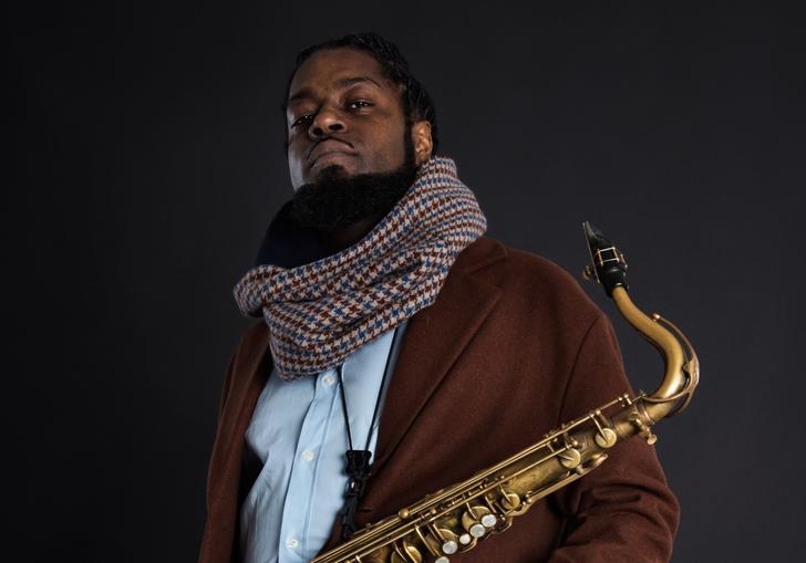 Soweto Kinch holding saxophone