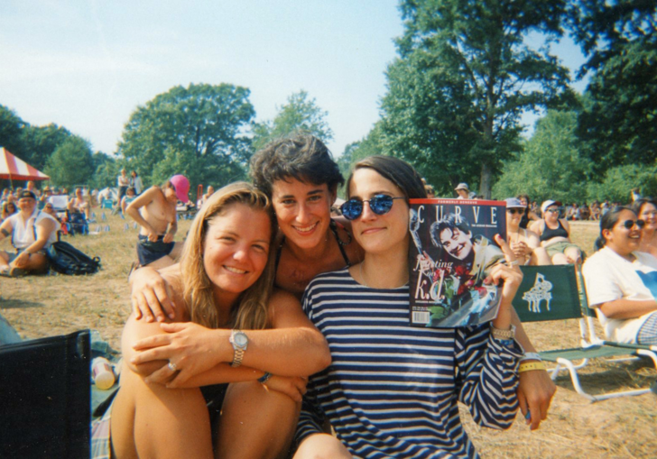 three woman take a photo together