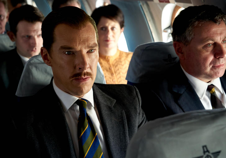 Men seated on a passenger flight
