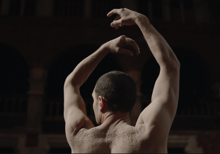 A still of a dancer with sand on their back in a screenshot from Robert Cohan's Lockdown Portrait