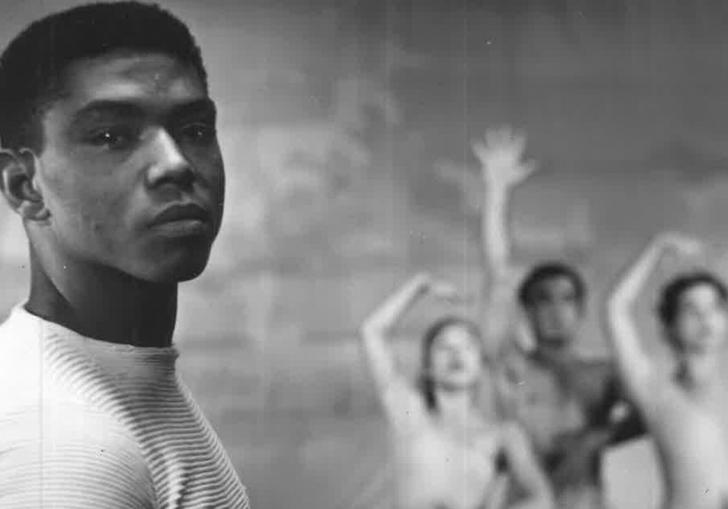 A portrait in b&w of Alvin Ailey, with three dancers in the background