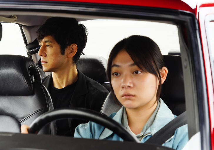 Car interior with lead actors Hidetoshi Nishijima and Toko Miura sitting inside