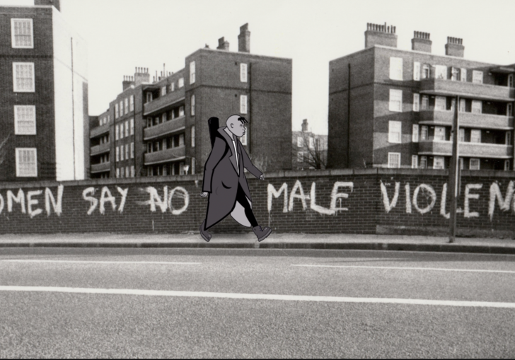 Black and white image of animated protagonist walking in front of graffiti that says 'Women Say No To Male Violence'